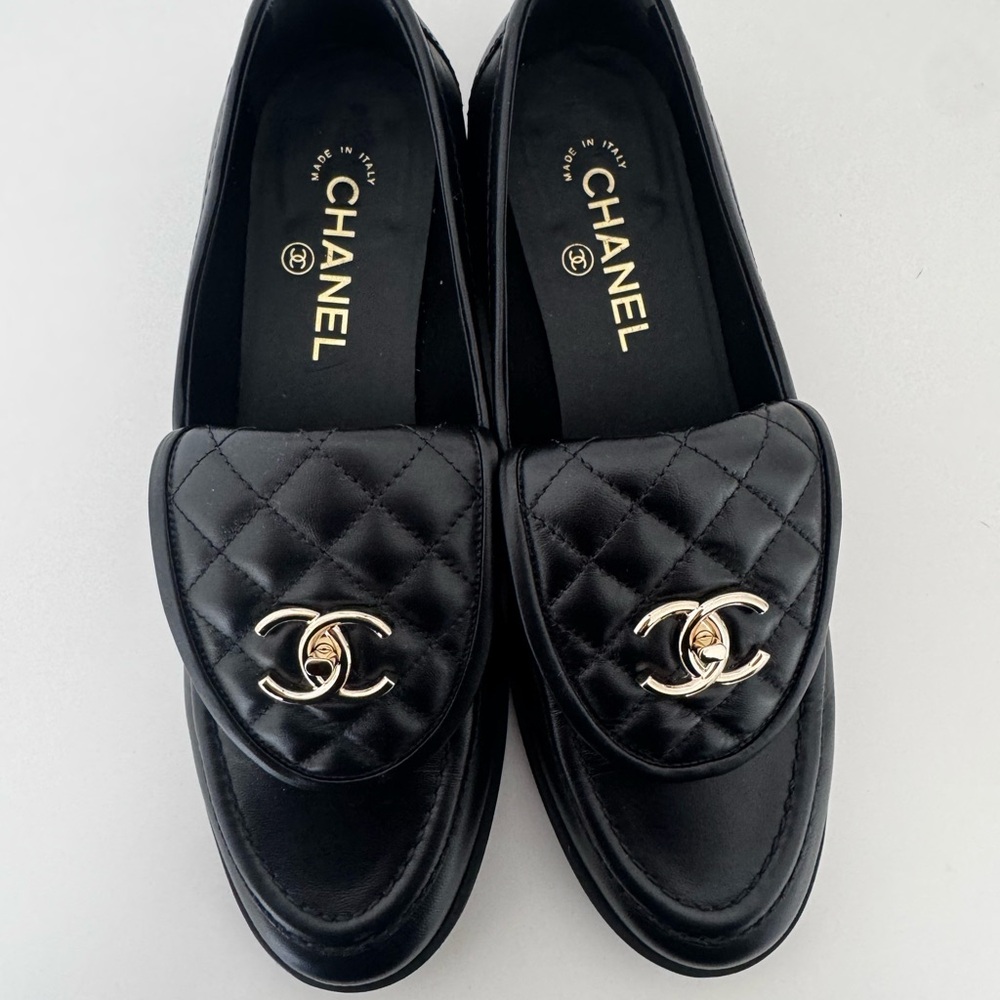 CHANEL Black Quilted Loafers with Gold Emblem